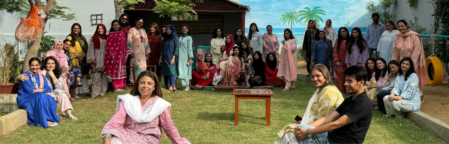 Children exploring paint materials at Kiva School