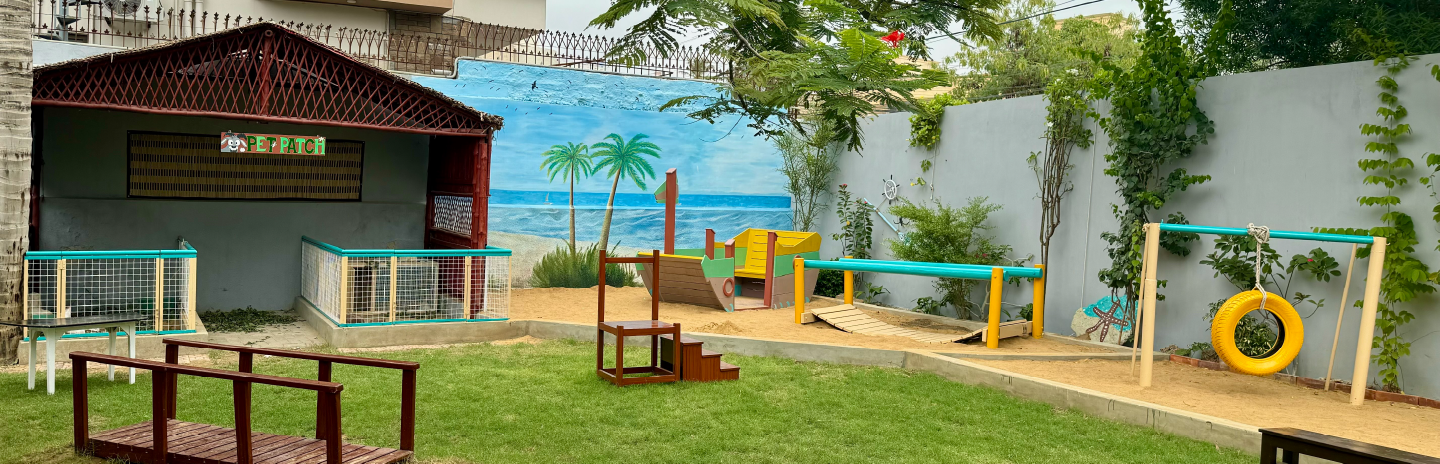 Children exploring paint materials at Kiva School