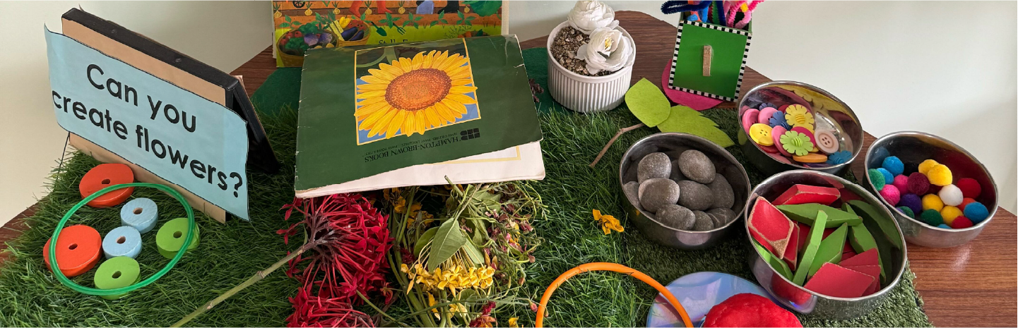 Children exploring paint materials at Kiva School